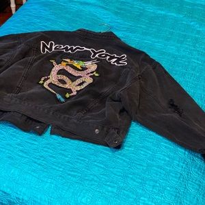 Black Jean trucker jacket with dragon print